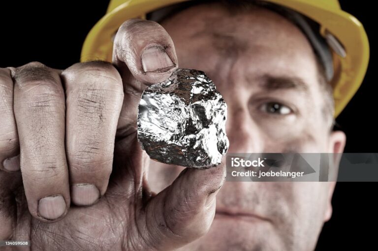 A silver miner shows off his newly excavated silver nugget