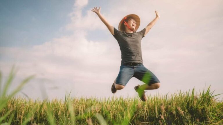 Farmer-jumping-for-joy-in-field-1200x675