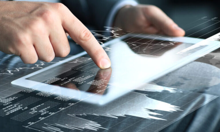 businessman touching screen of tablet computer