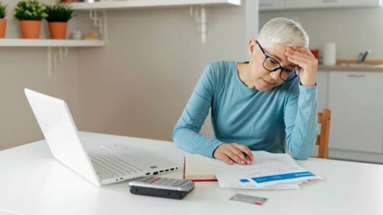 Woman-working-on-laptop-making-financial-decisions-1200x675