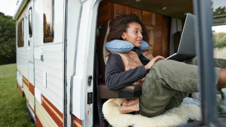 woman-using-laptop-in-campervan-1200x675